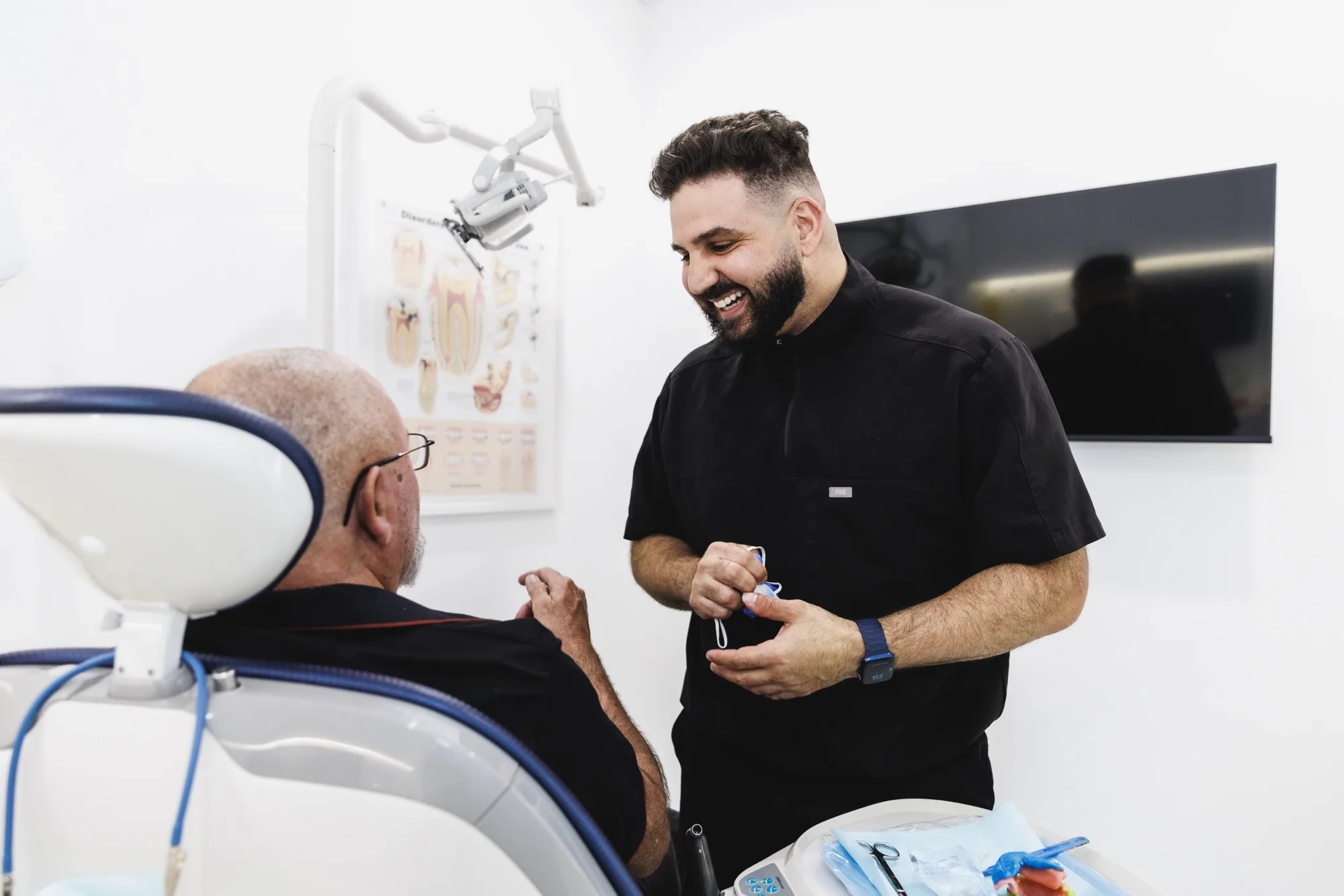 Hussein Ali Mourad speaking with a patient in the clinic